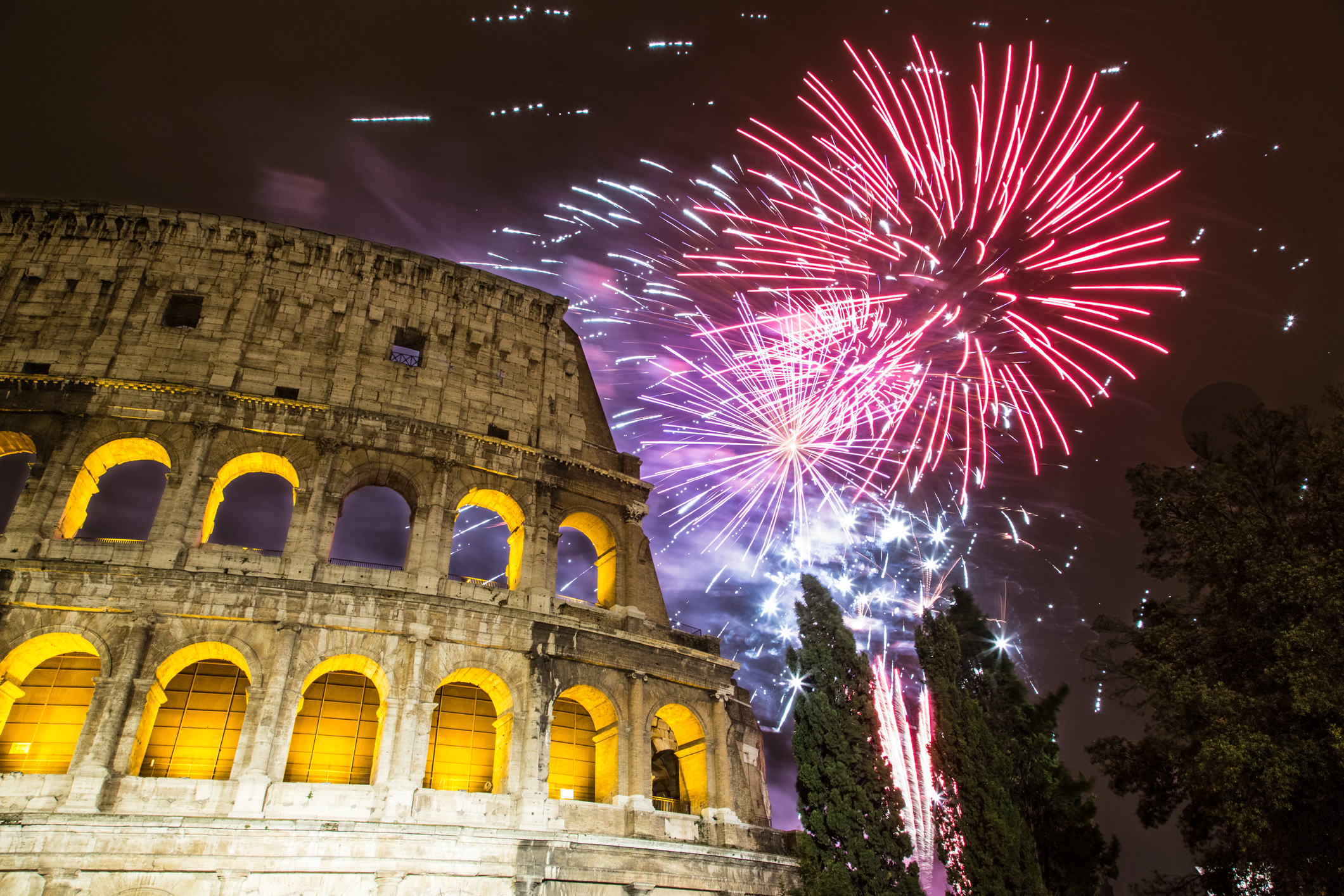 New Year's fireworks in the sky by the Colosseum in Rome : Stock Photo